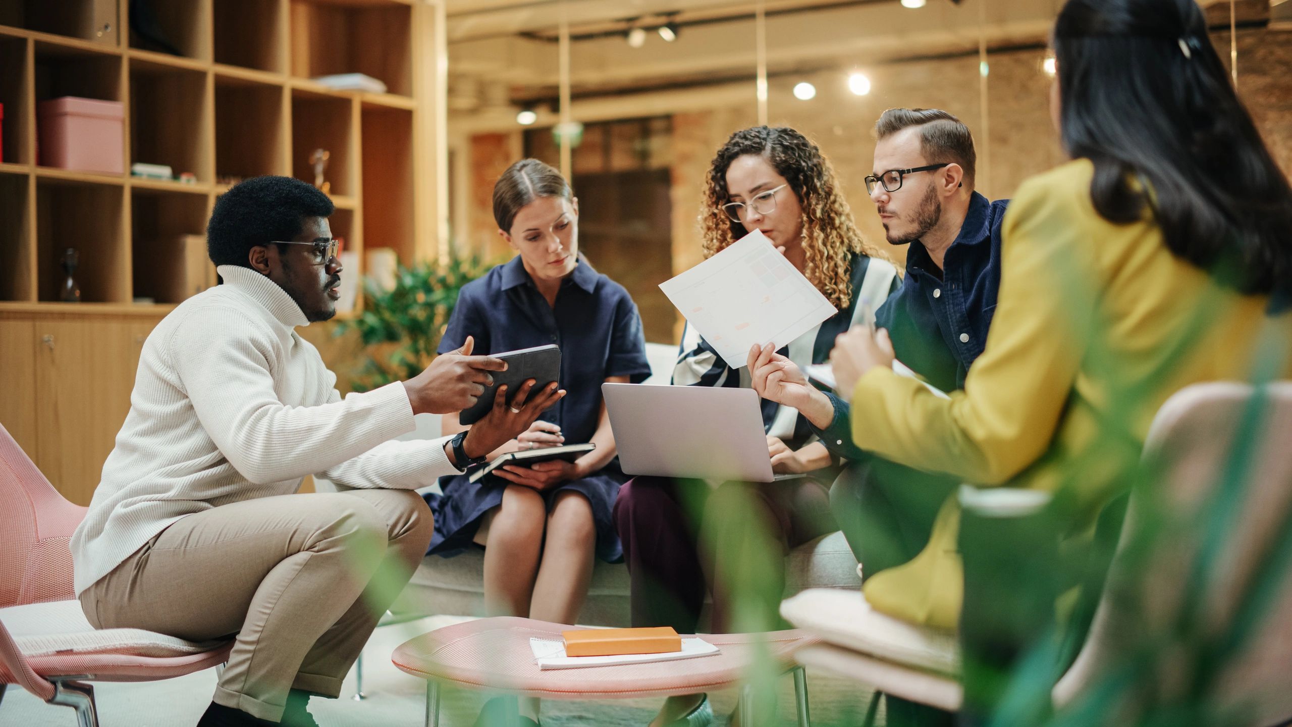 Team leader presenting ideas to colleagues in a meeting
